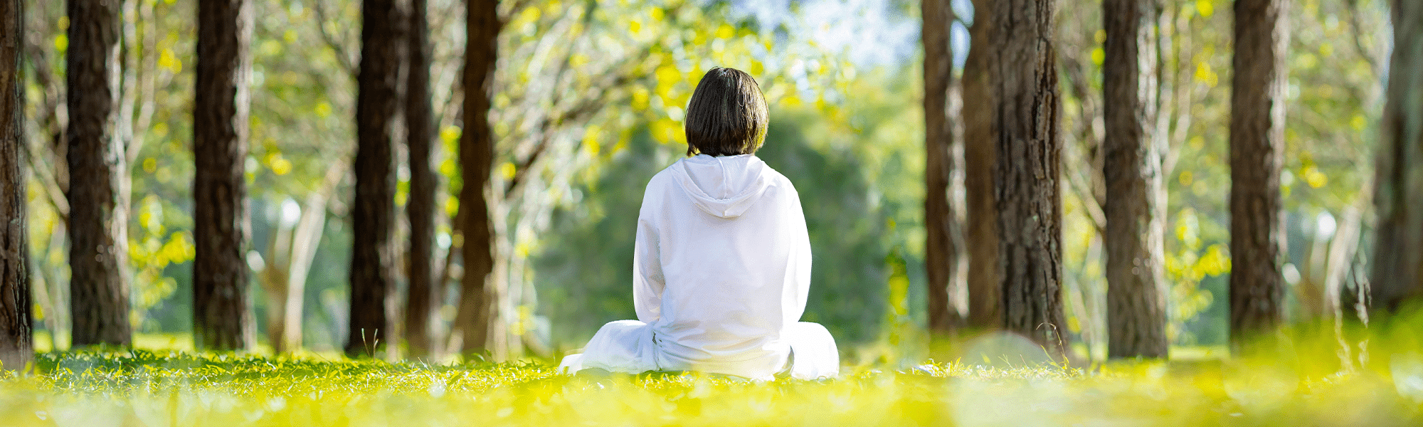 Woman sitting in a forest